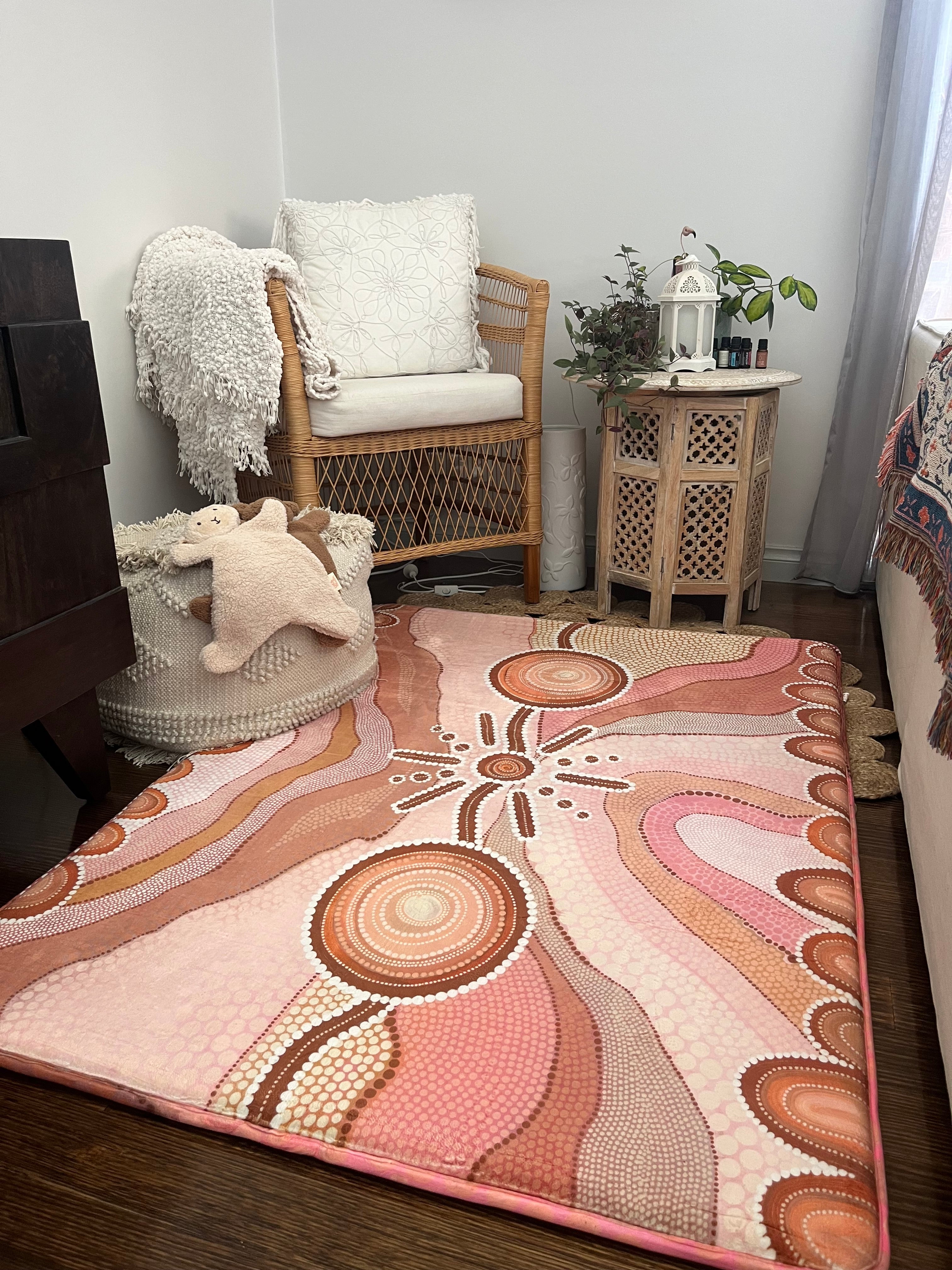 A soft rug situated on the living room floor, providing comfort and visual interest to the area.