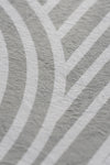 A close-up view of a textured pattern featuring shades of white and grey.