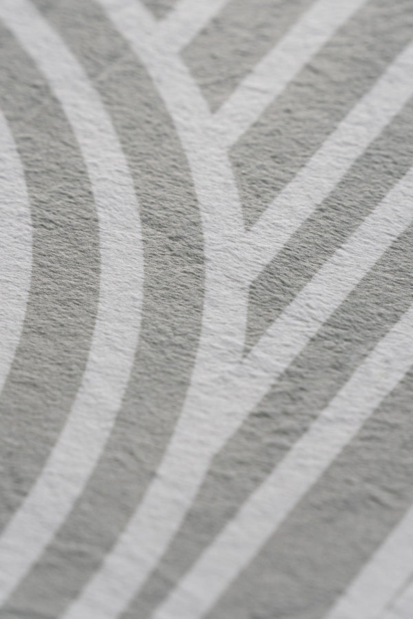 A close-up view of a textured pattern featuring shades of white and grey.