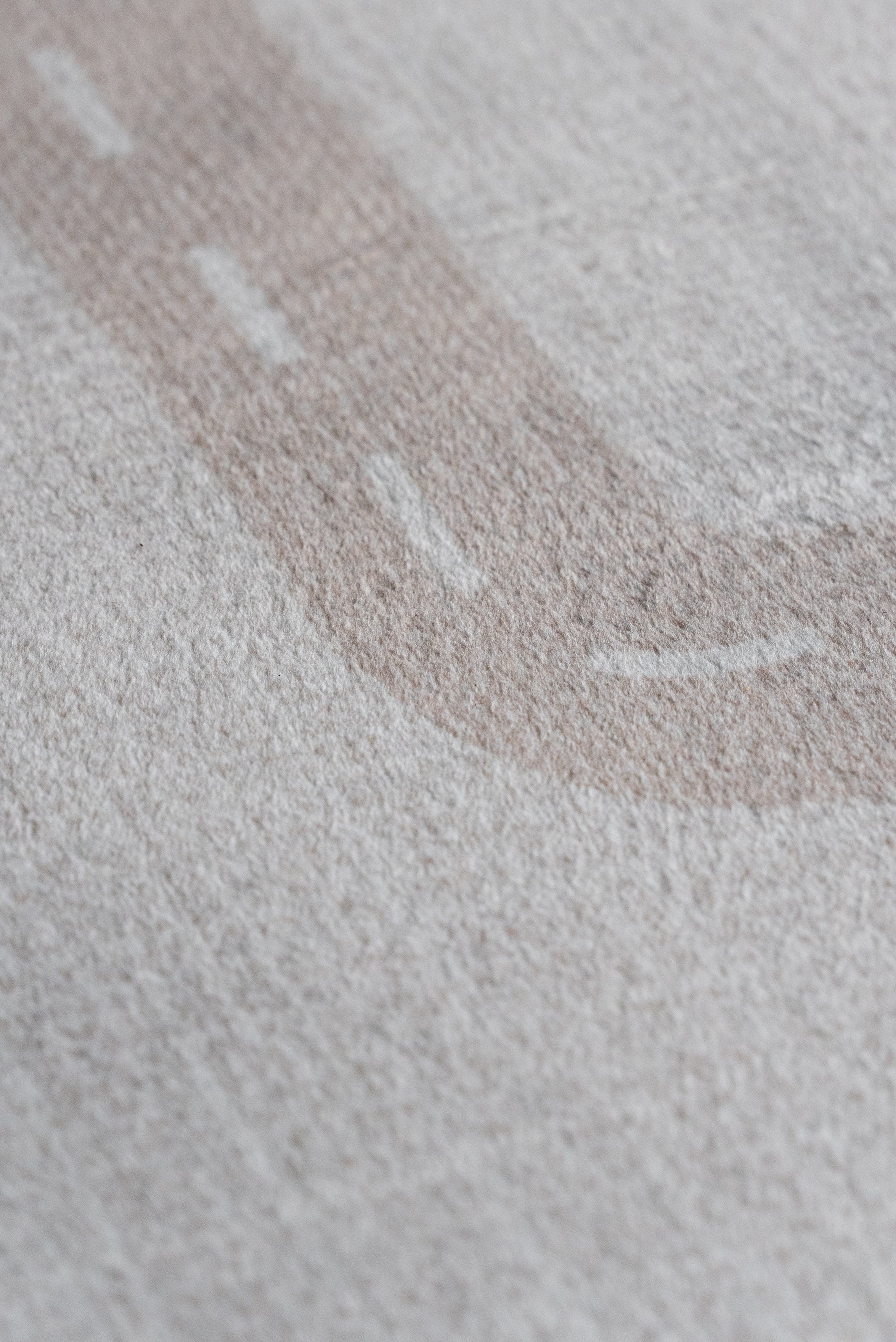 Close-up of a fabric featuring a detailed road design, showcasing textures and colors