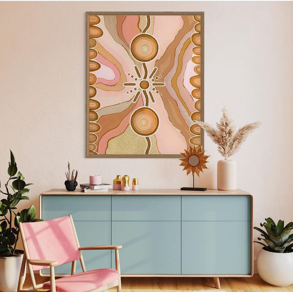 A vibrant abstract painting featuring pink and orange swirls on a wall, creating a dynamic visual impact.