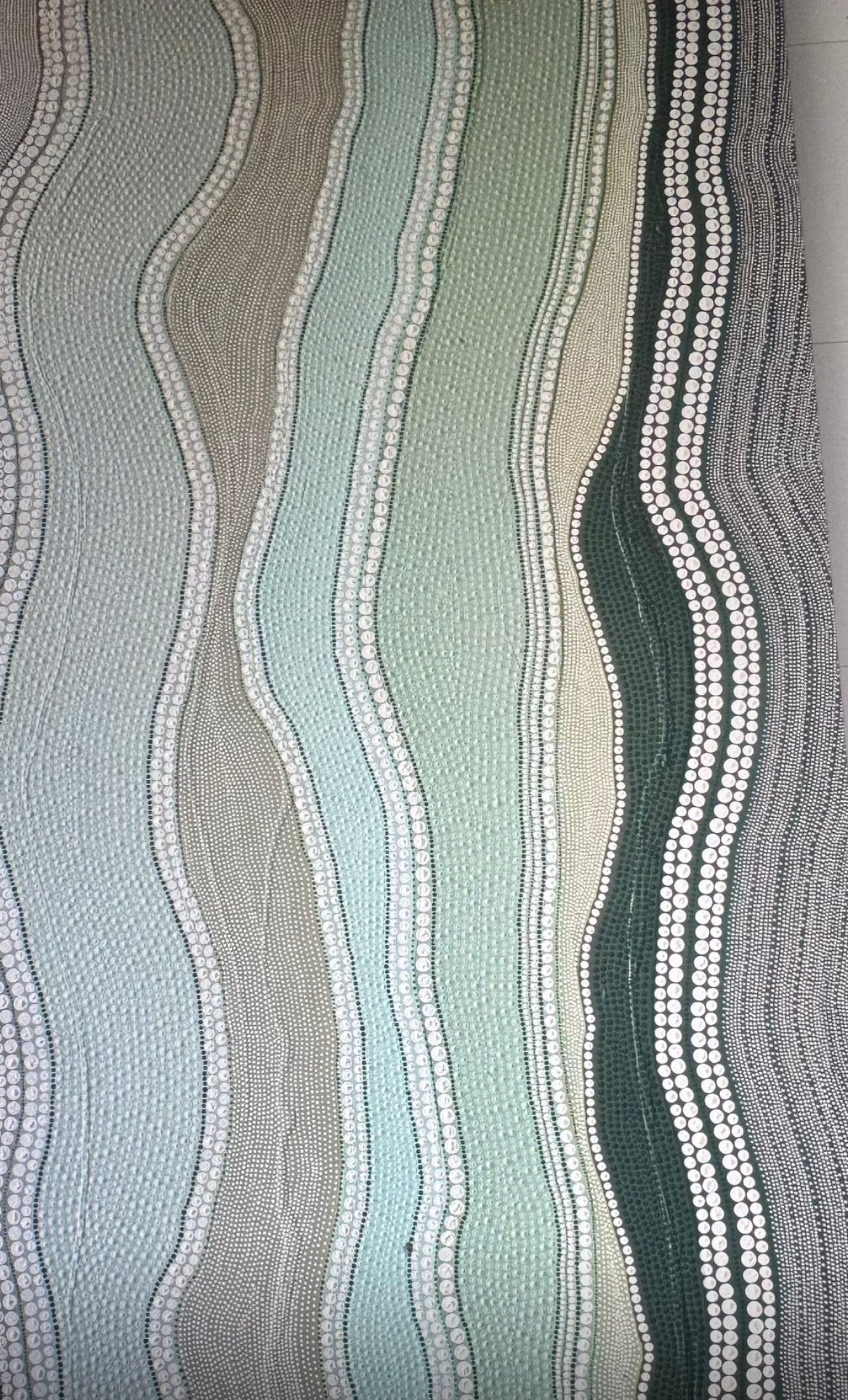 A stylish rug with waves displayed in a living room, contributing to the overall aesthetic of the space.