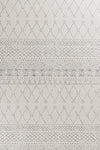 White and gray boho rug featuring a modern geometric pattern, creating a stylish and contemporary aesthetic.