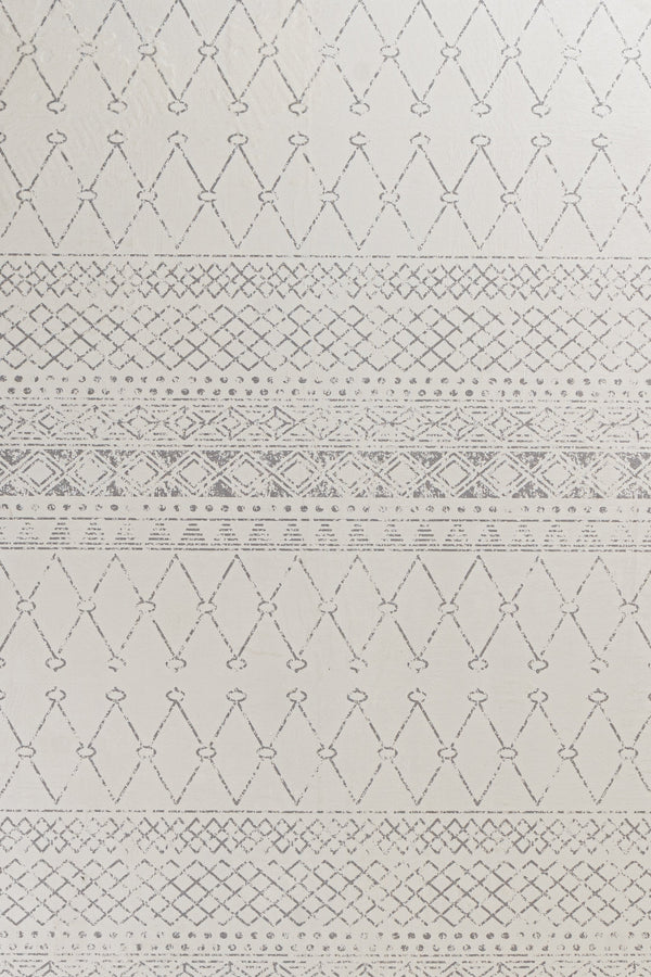 White and gray boho rug featuring a modern geometric pattern, creating a stylish and contemporary aesthetic.